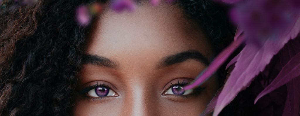 Beautiful woman with purple eyes